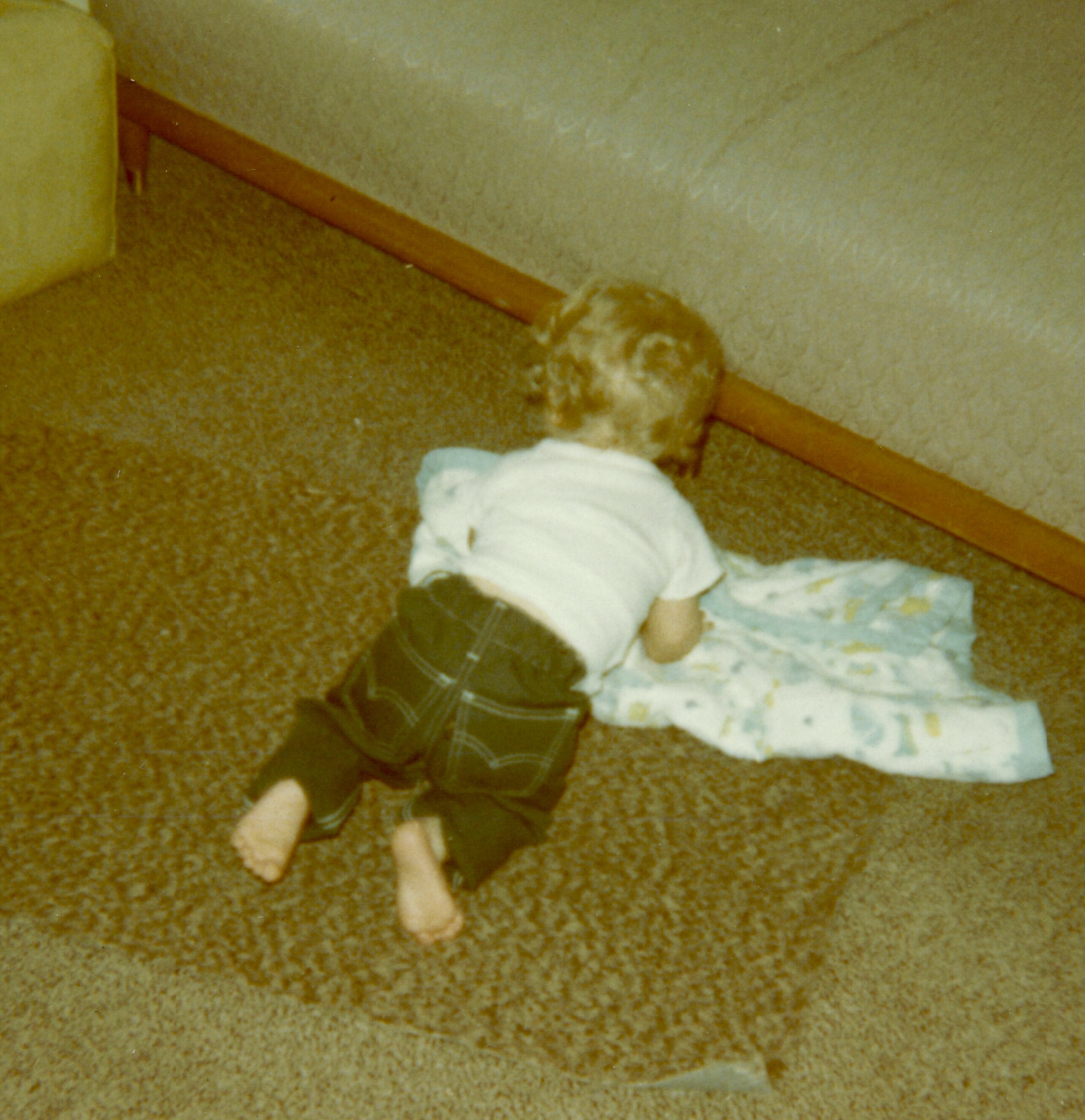 Eric with his first pair of jeans and the quilt that Grandma Fritz made for him.